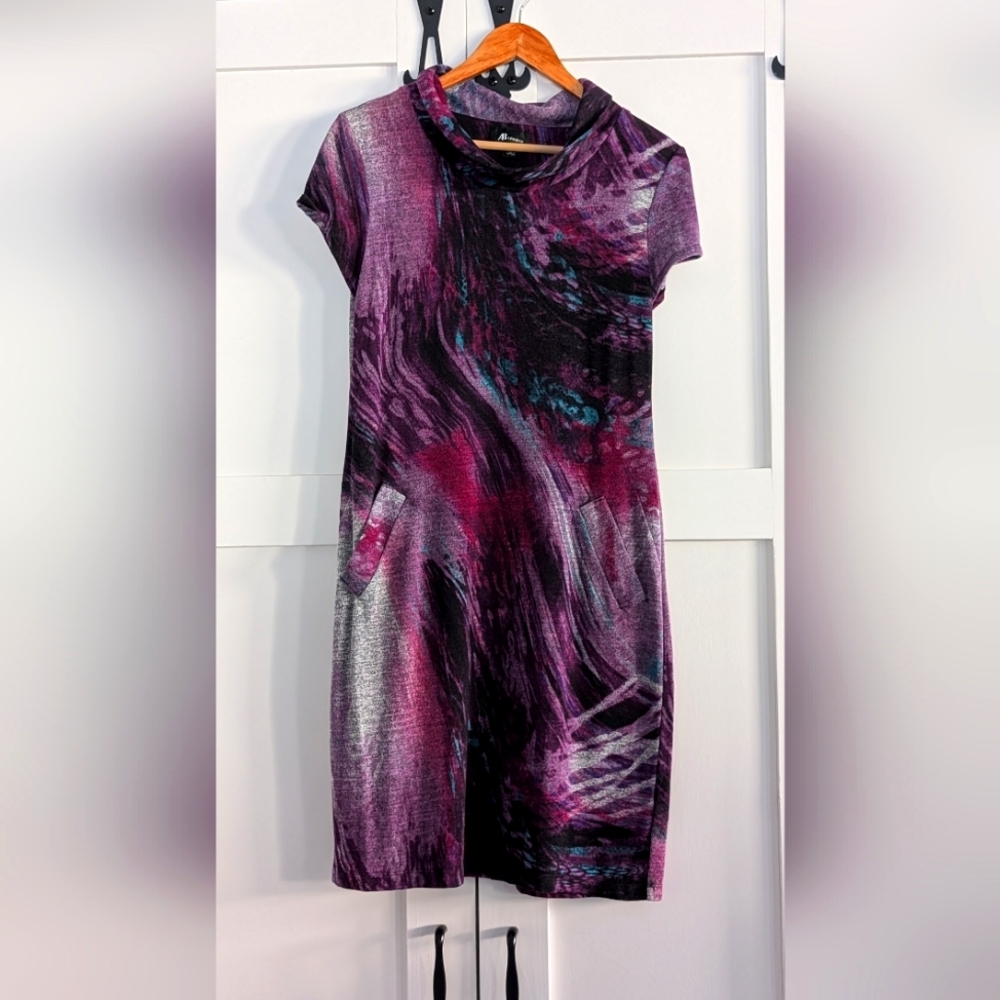 Cap sleeve lightweight sweater dress with galactic print.